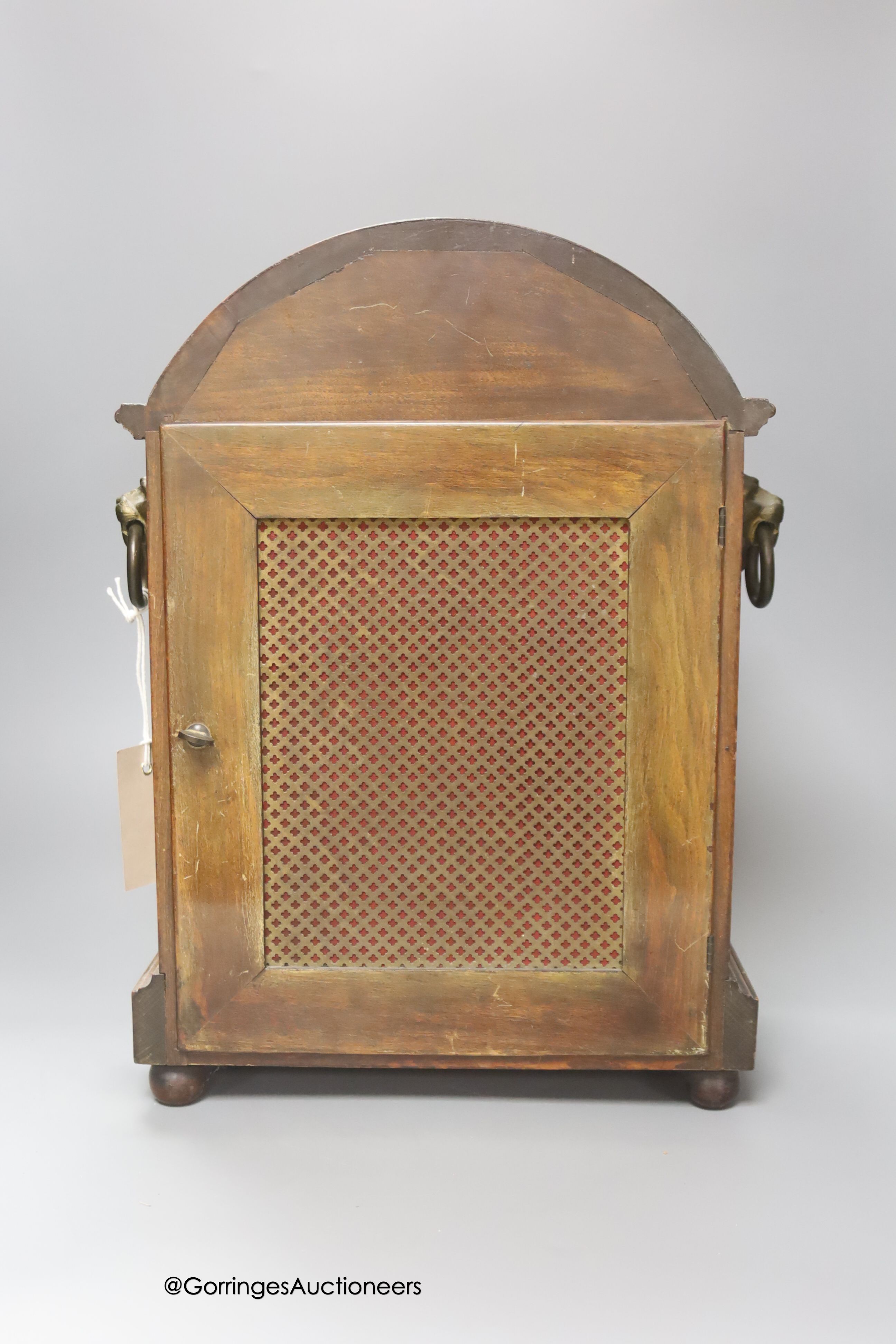 An Edwardian inlaid mahogany mantel clock, with lion mask ring handles, with key and pendulum, height 38cm